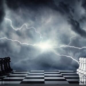 chessboard with black and white pieces on each side in starting position lighting strikes between the kings against dark background